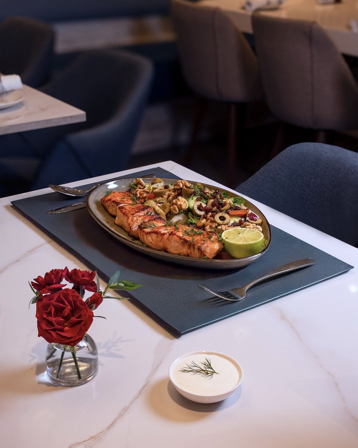 Grilled salmon with a walnut and olive salad in Westwood Village